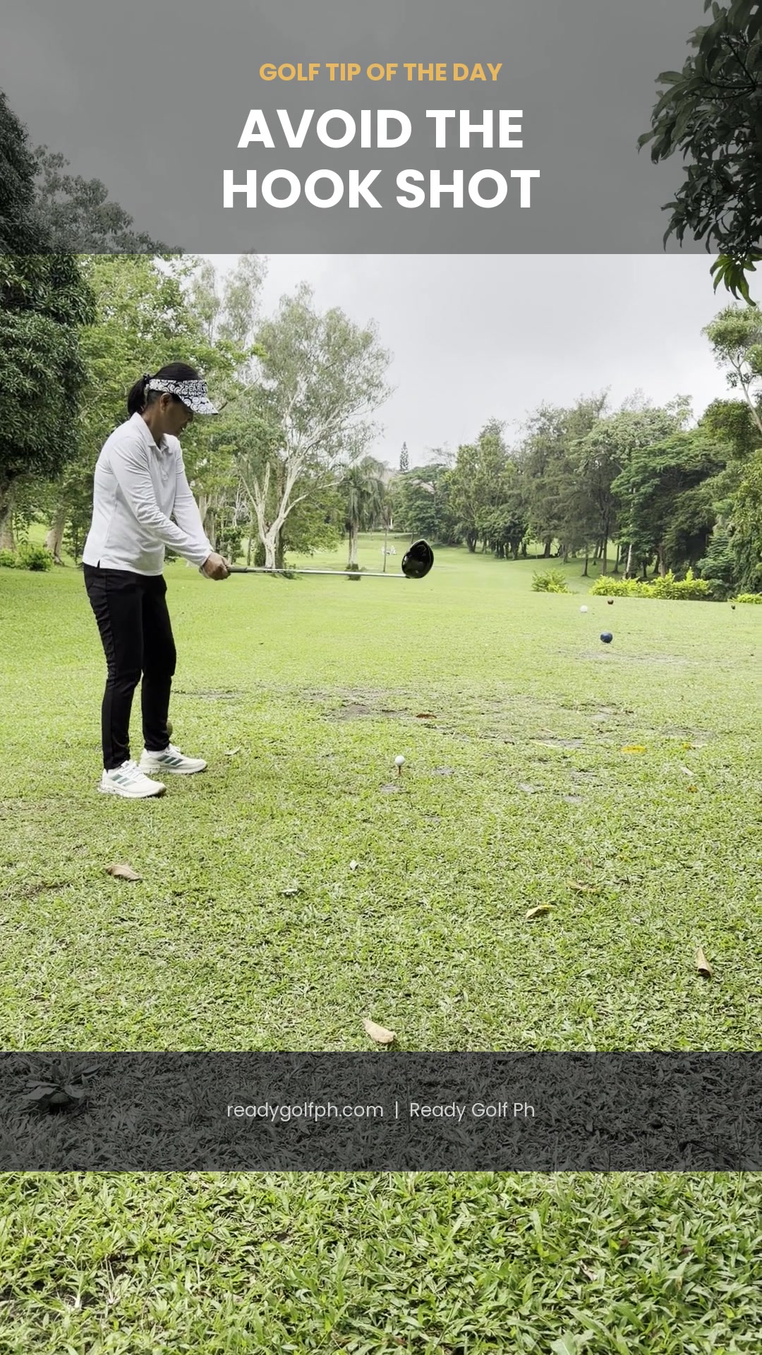 Golfer addressing the ball with a driver, checking grip before the swing to avoid a hook