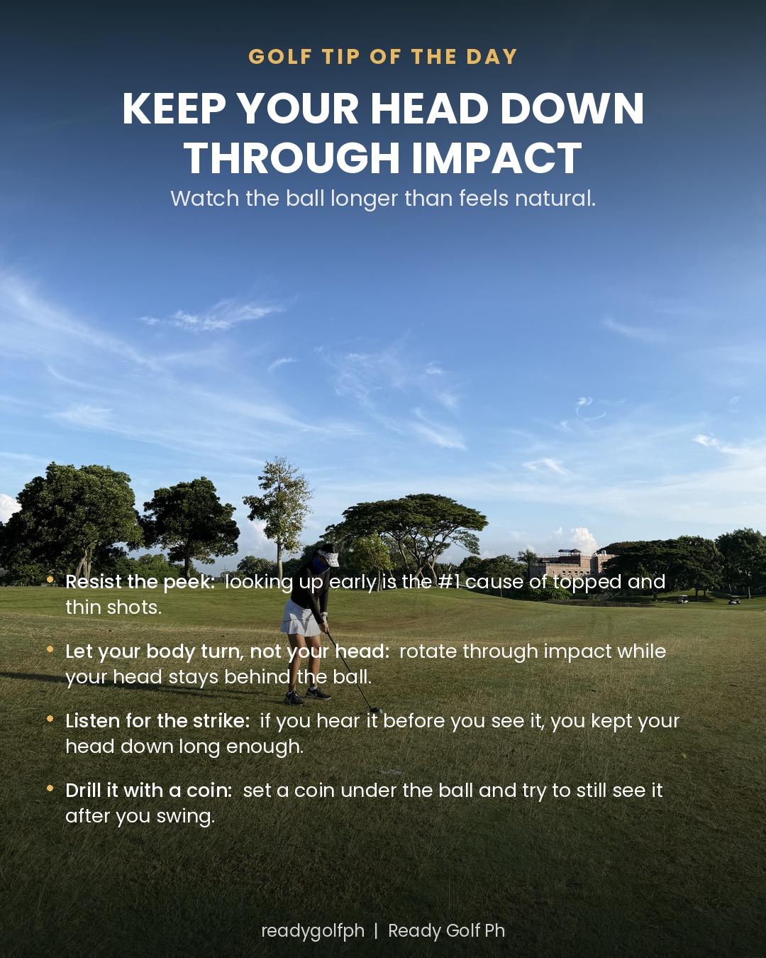 A golfer at address on an open fairway, driver set behind the ball, before the swing begins